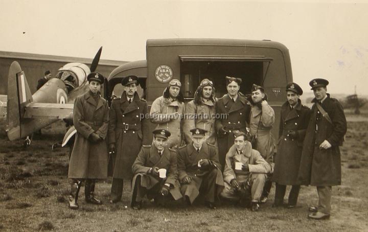 Peter Provenzano Photo Album Image_copy_017.jpg - The 71st Eagle Squadron taking a break from training at the YMCA canteen truck.  Peter Provenzano is standing second from the right.  RAF Station Sealand, October 1940.
